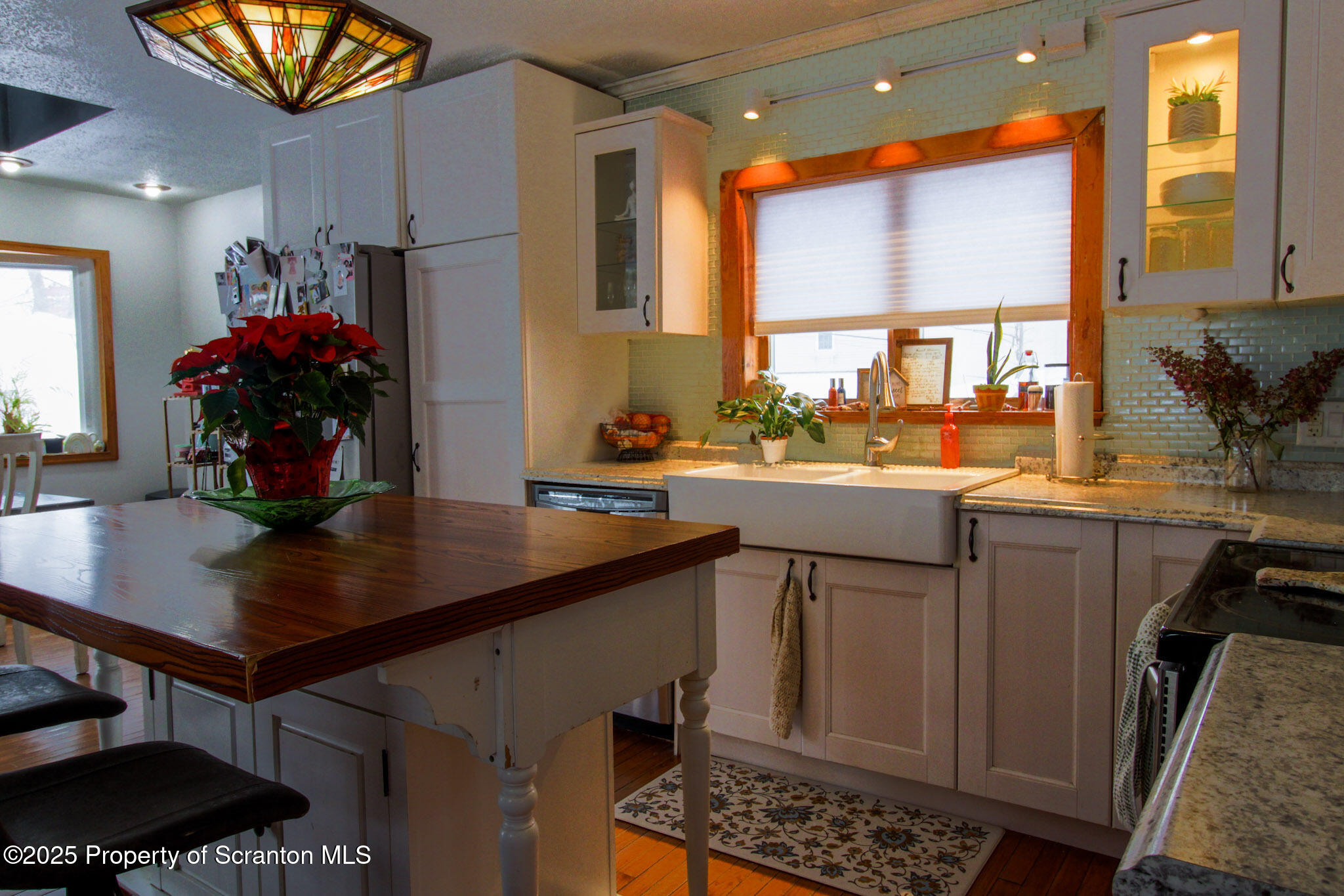 316 Bridge Street Blakely, PA 18452 - Photo 17 of 39 a kitchen with a sink appliances and cabinets