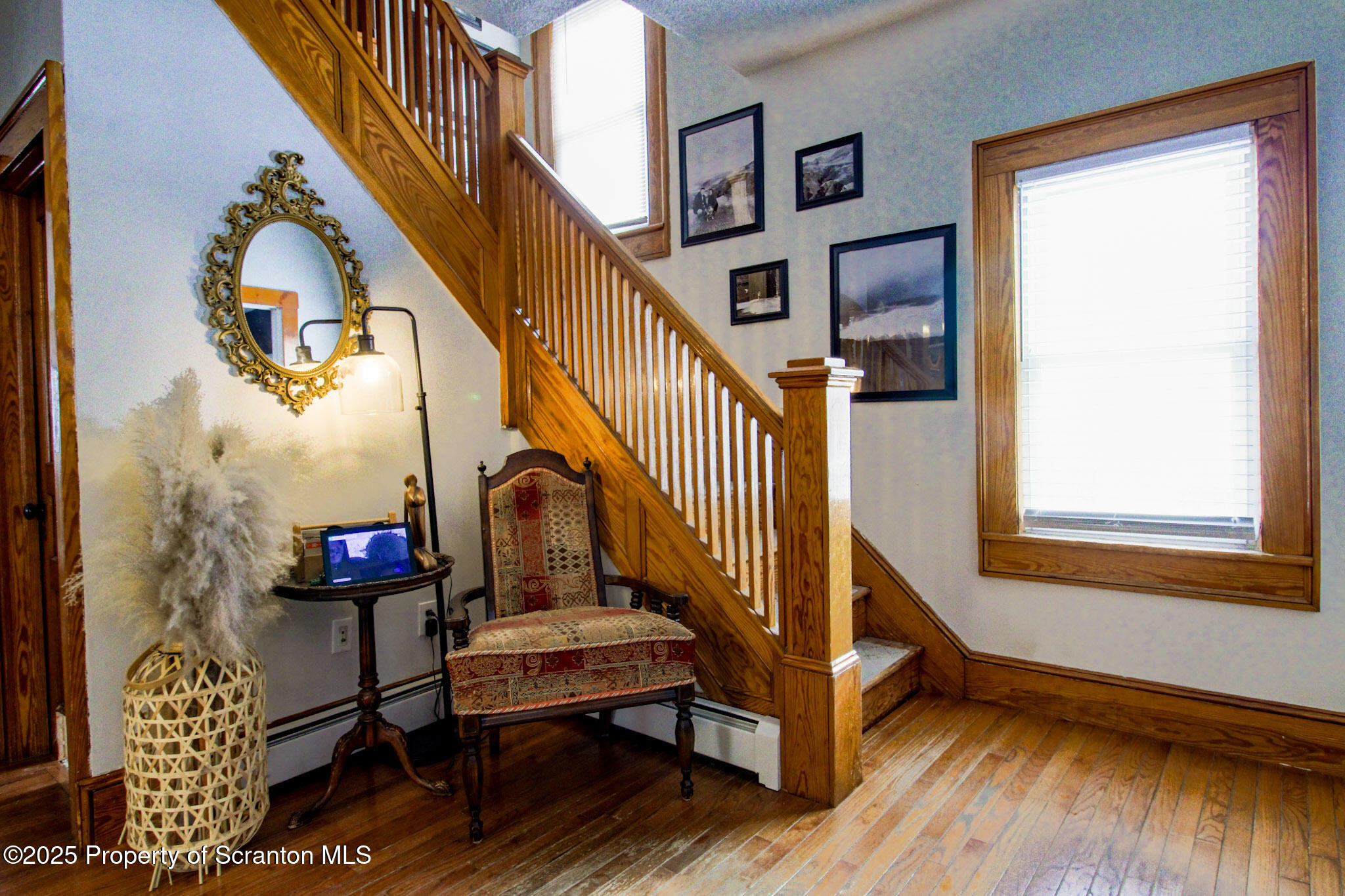 316 Bridge Street Blakely, PA 18452 - Photo 20 of 39 a view of staircase with wooden floor and a potted plant