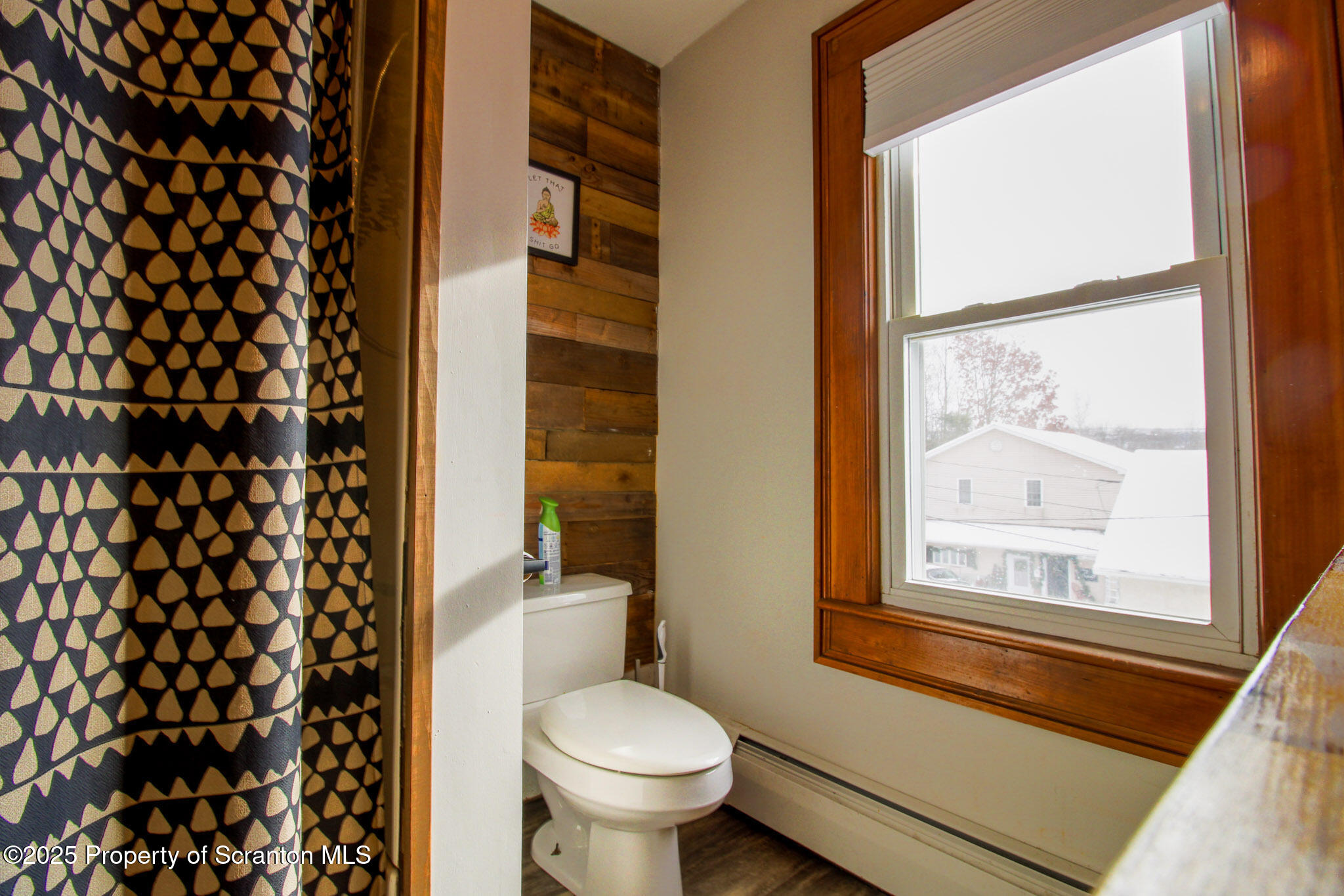 316 Bridge Street Blakely, PA 18452 - Photo 24 of 39 a bathroom with a toilet and a shower curtain
