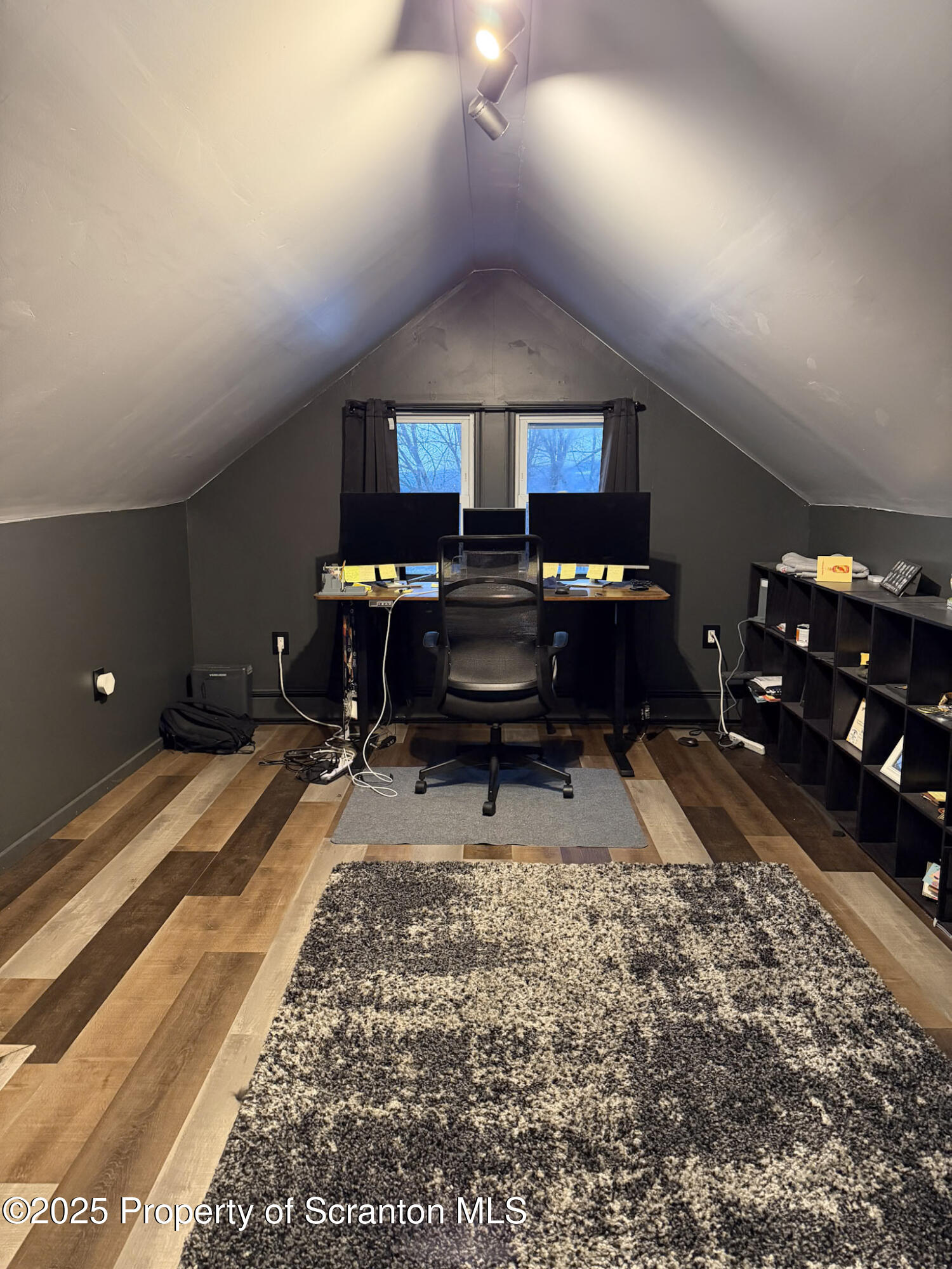 316 Bridge Street Blakely, PA 18452 - Photo 33 of 39 a living room with furniture a dining table and chairs with rug