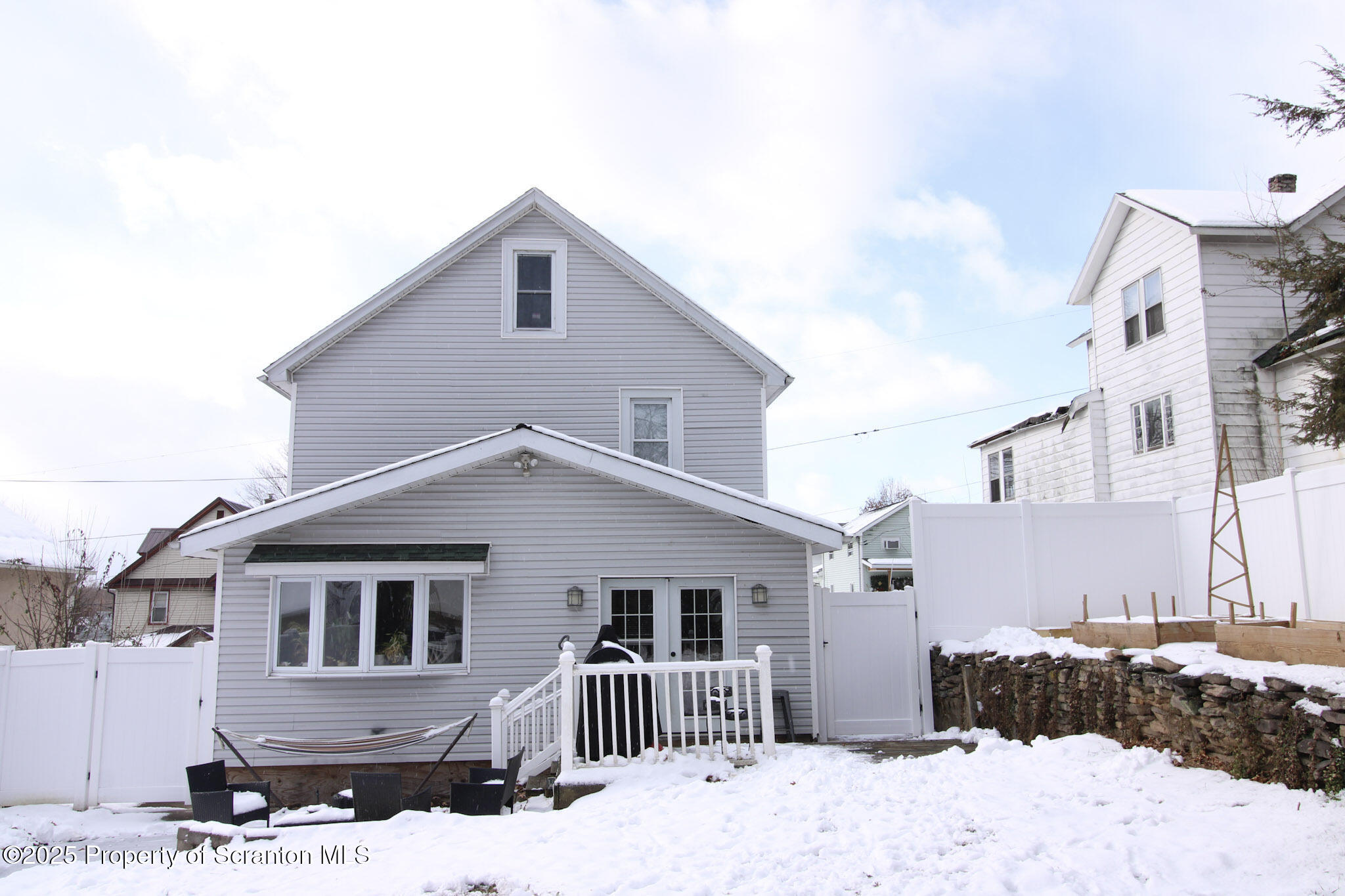 316 Bridge Street Blakely, PA 18452 - Photo 38 of 39 a front view of a house with a yard covered in snow