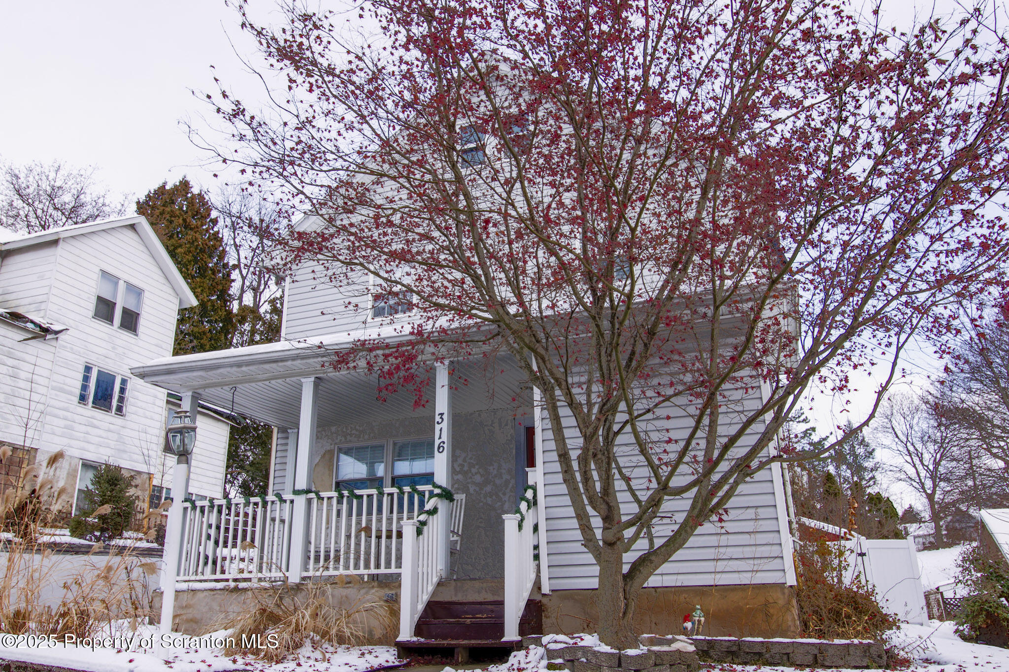 316 Bridge Street Blakely, PA 18452 - Photo 39 of 39 front view of a house with a tree