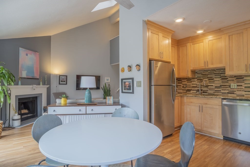 9 Barton Square, Unit 201 Salem, MA 01970 - Photo 13 of 42 a view of kitchen with furniture and wooden floor