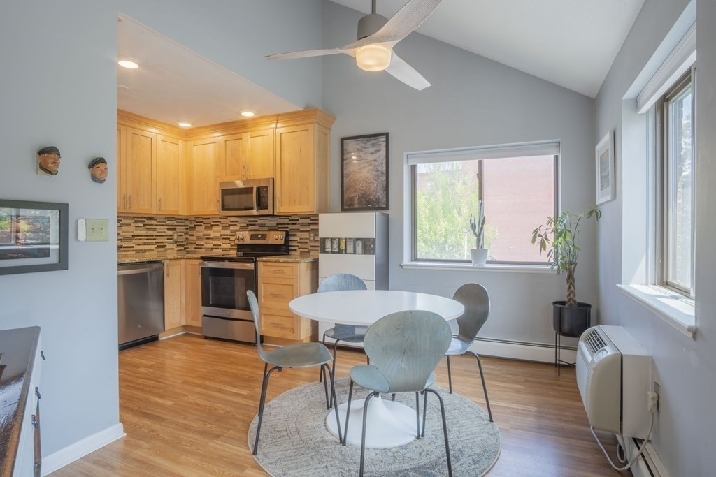 9 Barton Square, Unit 201 Salem, MA 01970 - Photo 18 of 42 a view of a dining room with furniture window and wooden floor