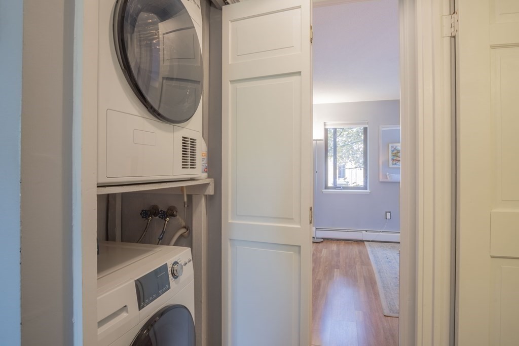 9 Barton Square, Unit 201 Salem, MA 01970 - Photo 25 of 42 a close view of a utility room with dryer and washer