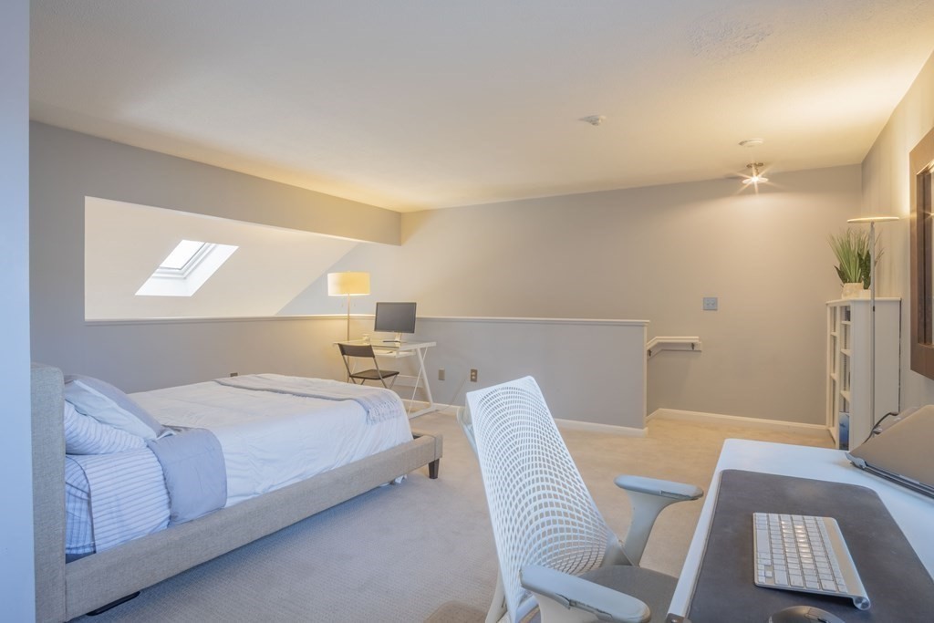 9 Barton Square, Unit 201 Salem, MA 01970 - Photo 27 of 42 a bedroom with a bed and a window