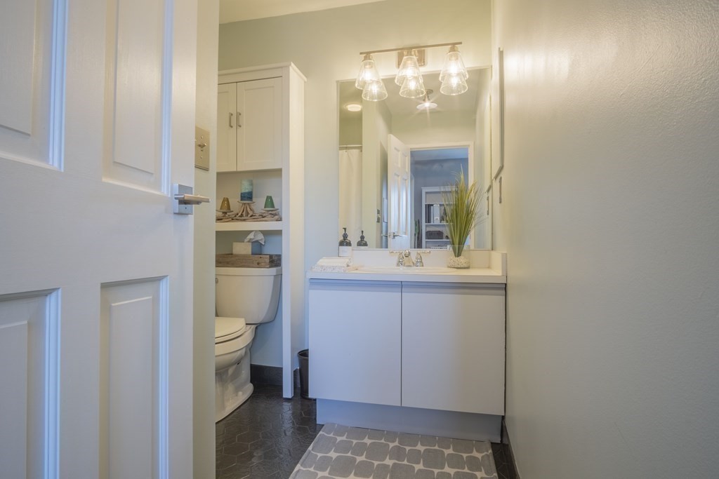 9 Barton Square, Unit 201 Salem, MA 01970 - Photo 33 of 42 a bathroom with a sink a toilet and shower