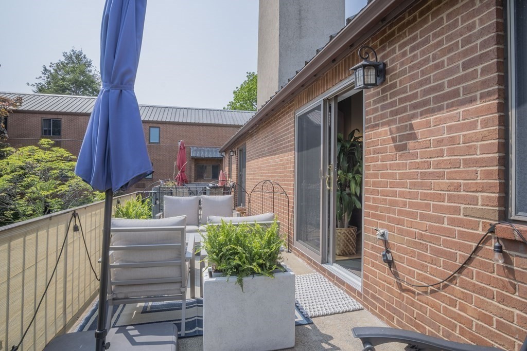 9 Barton Square, Unit 201 Salem, MA 01970 - Photo 37 of 42 a front view of a house with a garden