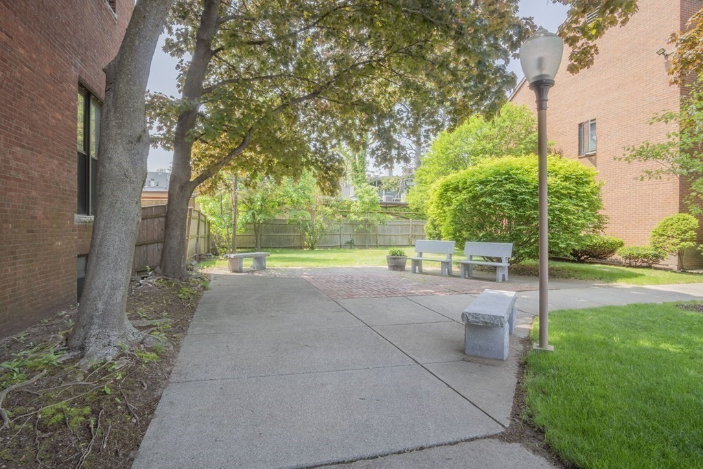 9 Barton Square, Unit 201 Salem, MA 01970 - Photo 40 of 42 a view of backyard with plants and trees