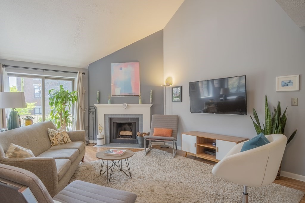 9 Barton Square, Unit 201 Salem, MA 01970 - Photo 5 of 42 a living room with furniture fireplace and window