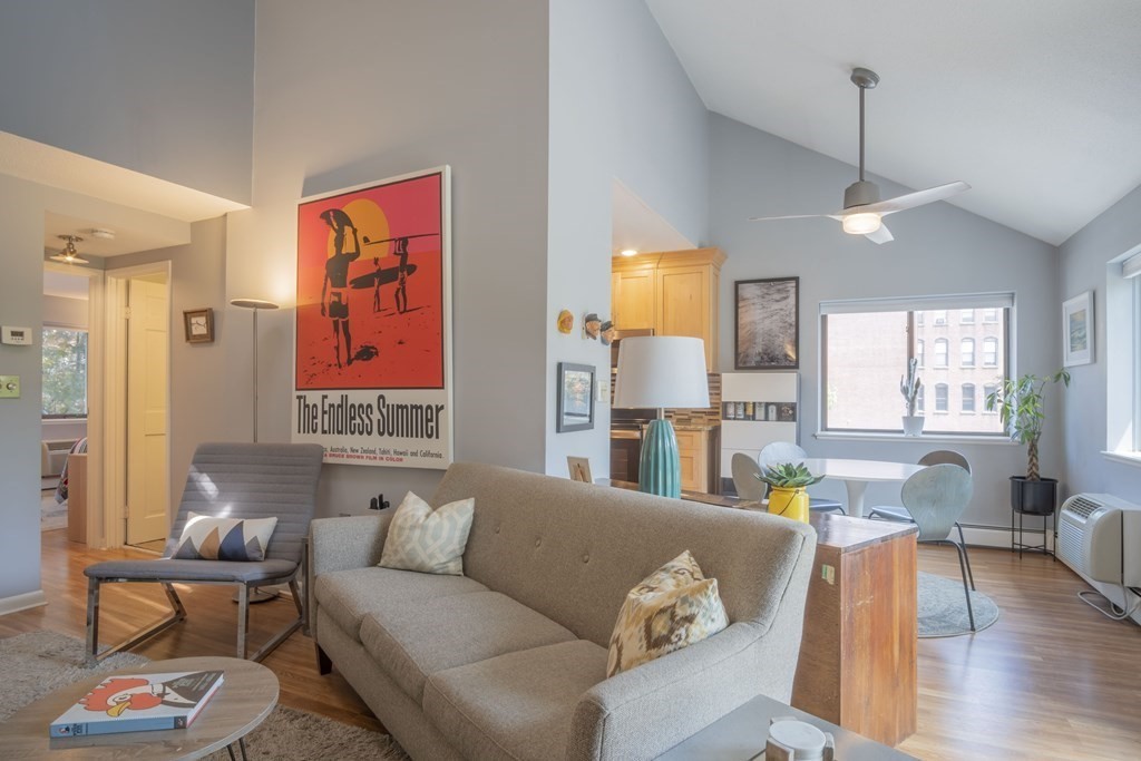 9 Barton Square, Unit 201 Salem, MA 01970 - Photo 9 of 42 a living room with furniture and wooden floor