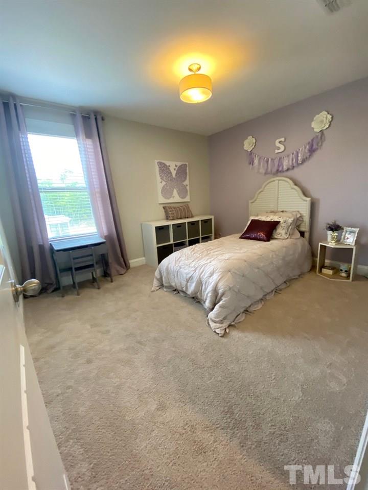 7060 Rex Road Holly Springs, NC 27540 - Photo 20 of 30 Beautiful bedroom upstairs with a walk-in closet