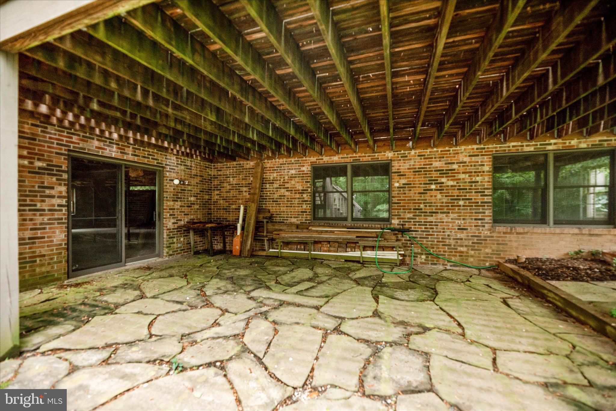 2221 Gold Mine Road Brookeville, MD 20833 - Photo 50 of 60 a view of a porch with a table and chairs