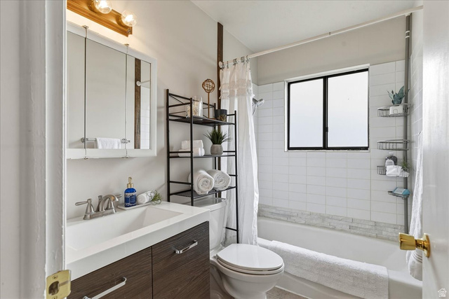 947 Canyon Road, Unit 29 Ogden, UT 84404 - Photo 14 of 19 Full bathroom with vanity and shower / tub combo with curtain