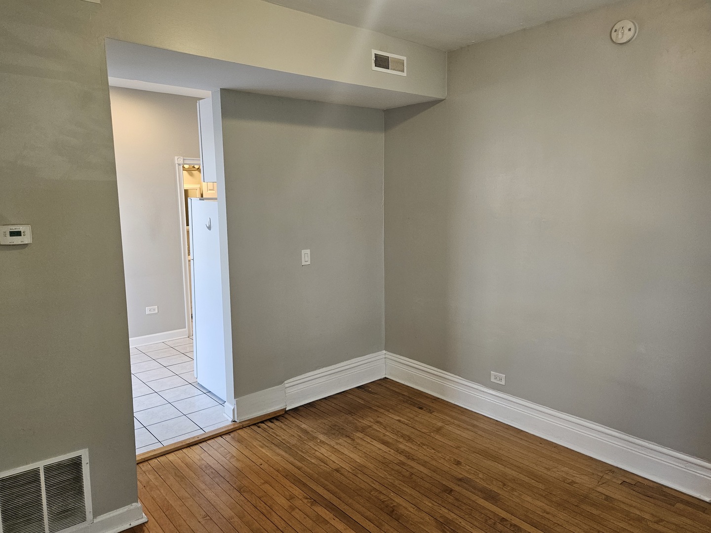 1025 West Cullerton Street, Unit 2F Chicago, IL 60608 - Photo 12 of 15 wooden floor in an empty room