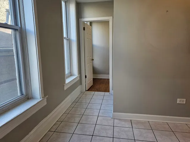 a view of an empty room with a bathroom