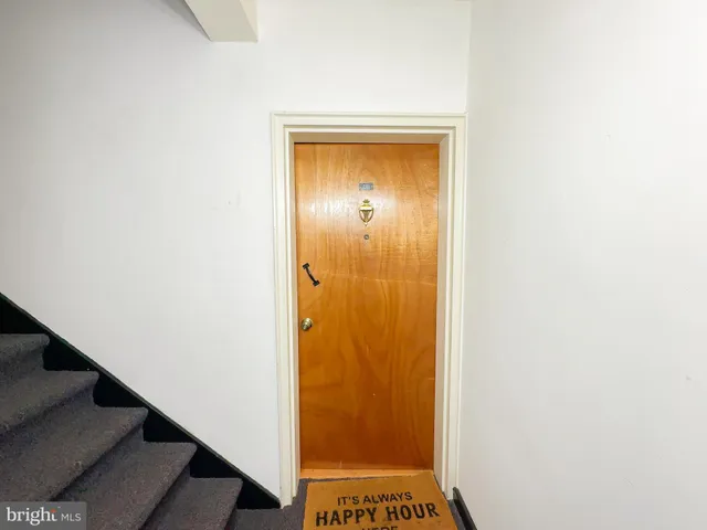 a view of bathroom with a door and a shower