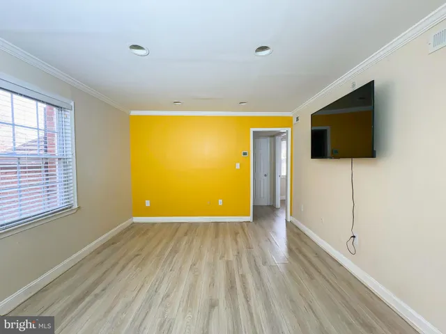 a view of a livingroom with wooden floor