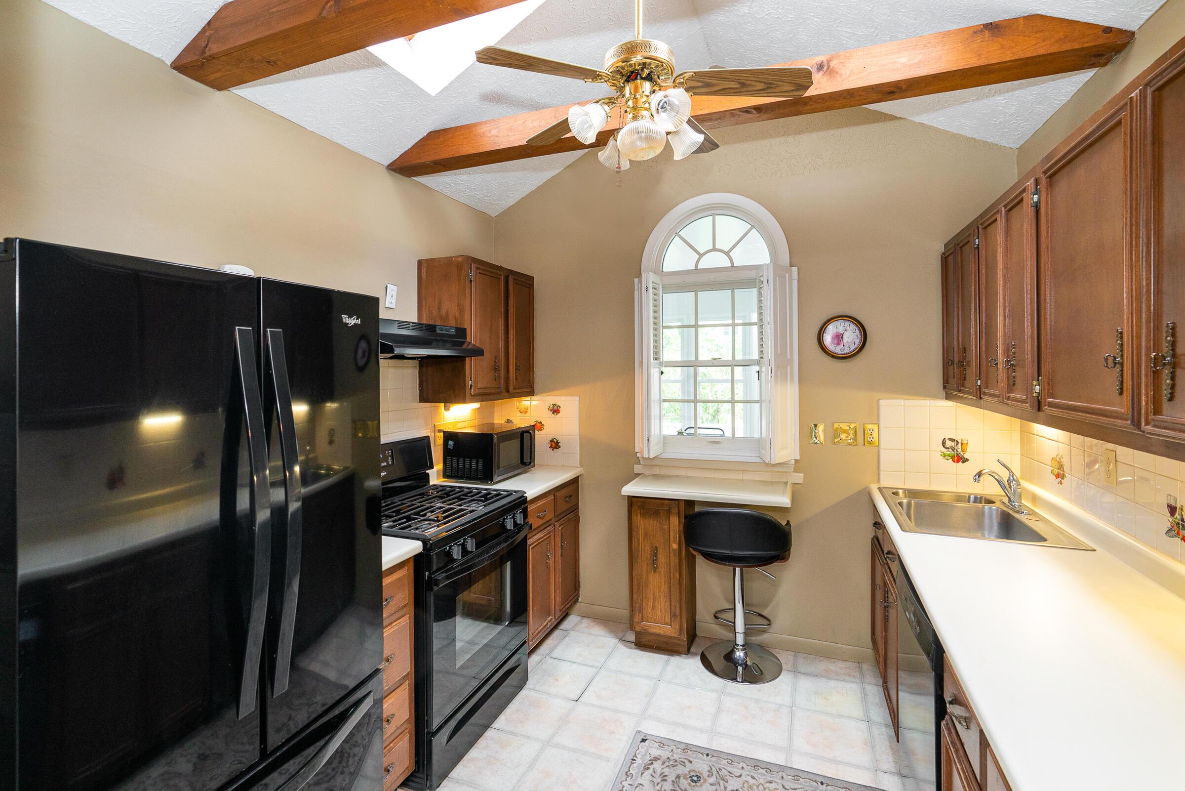 136 Brighton Road Columbus, OH 43202 - Photo 12 of 36 Enjoy vaulted ceiling & skylights in this well-equipped kitchen.