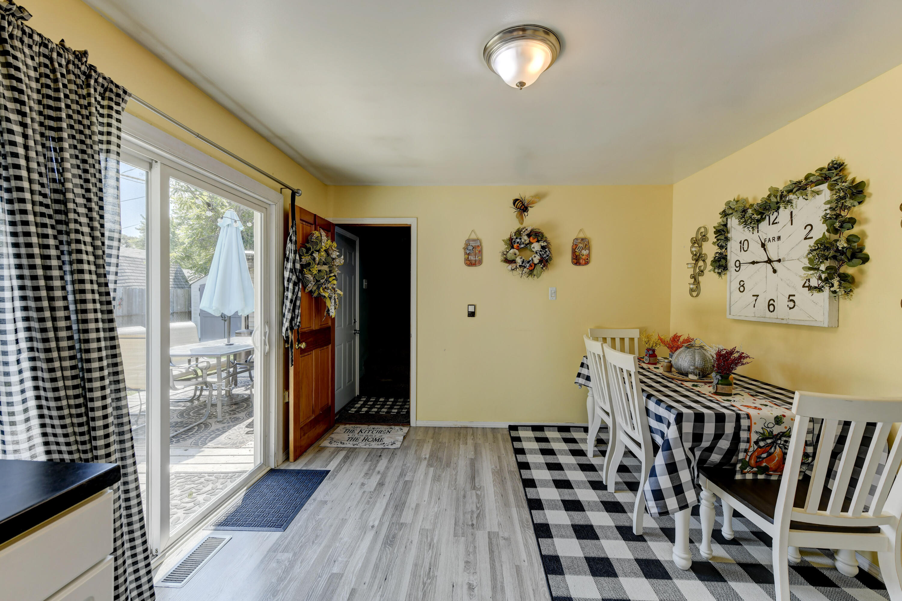 717 McCool Road Valparaiso, IN 46385 - Photo 5 of 18 a view of a hallway with wooden floor and windows