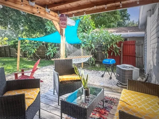 a view of an outdoor sitting area with furniture