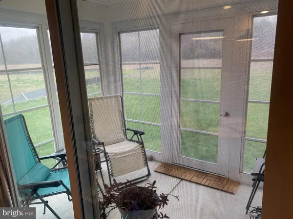a room with furniture and a window