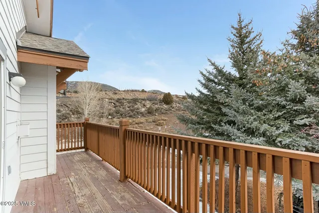 a balcony with view of outdoor space