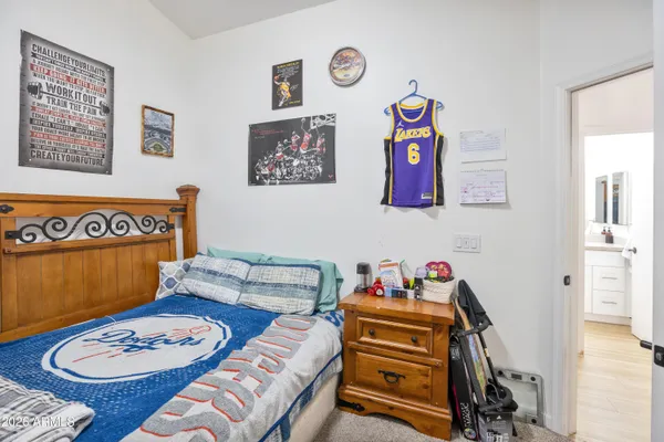a bedroom with a bed and a cabinets