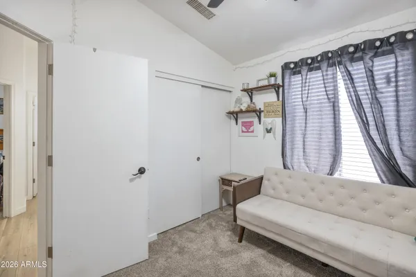 a bathroom with a double vanity sink mirror and shower