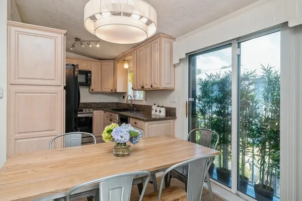 a kitchen with appliances cabinets and a counter top space