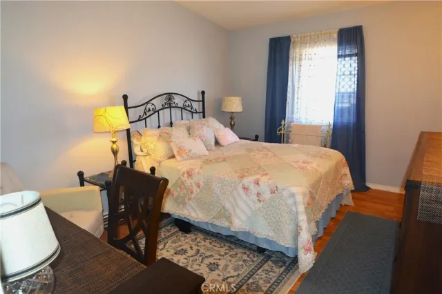 a bedroom with a bed and a table in it