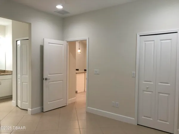 a view of a chairs and table in patio