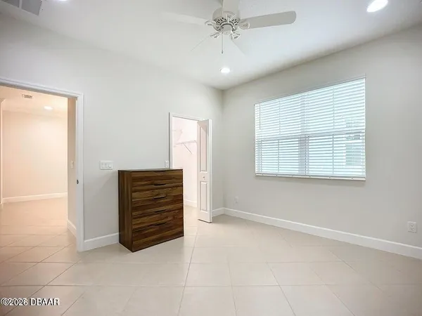 a view of a swimming pool with a table and chairs