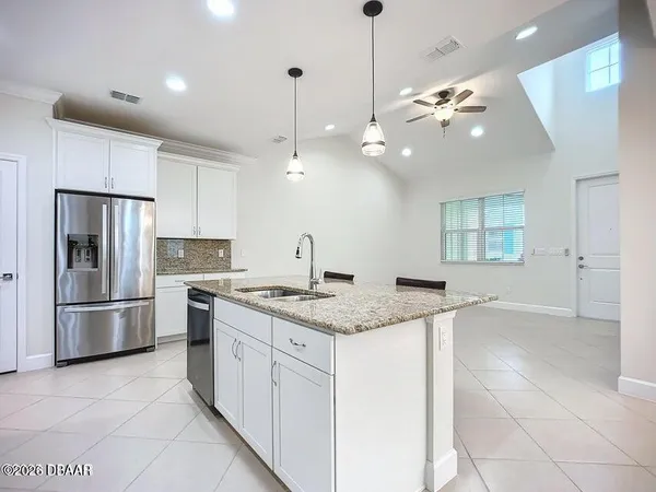 an empty room with closet and mirror