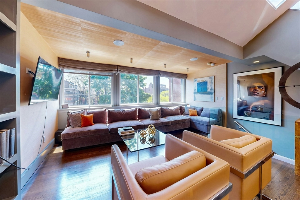 38 Worcester Street, Unit 3 Boston, MA 02118 - Photo 11 of 24 a living room with furniture and a large window