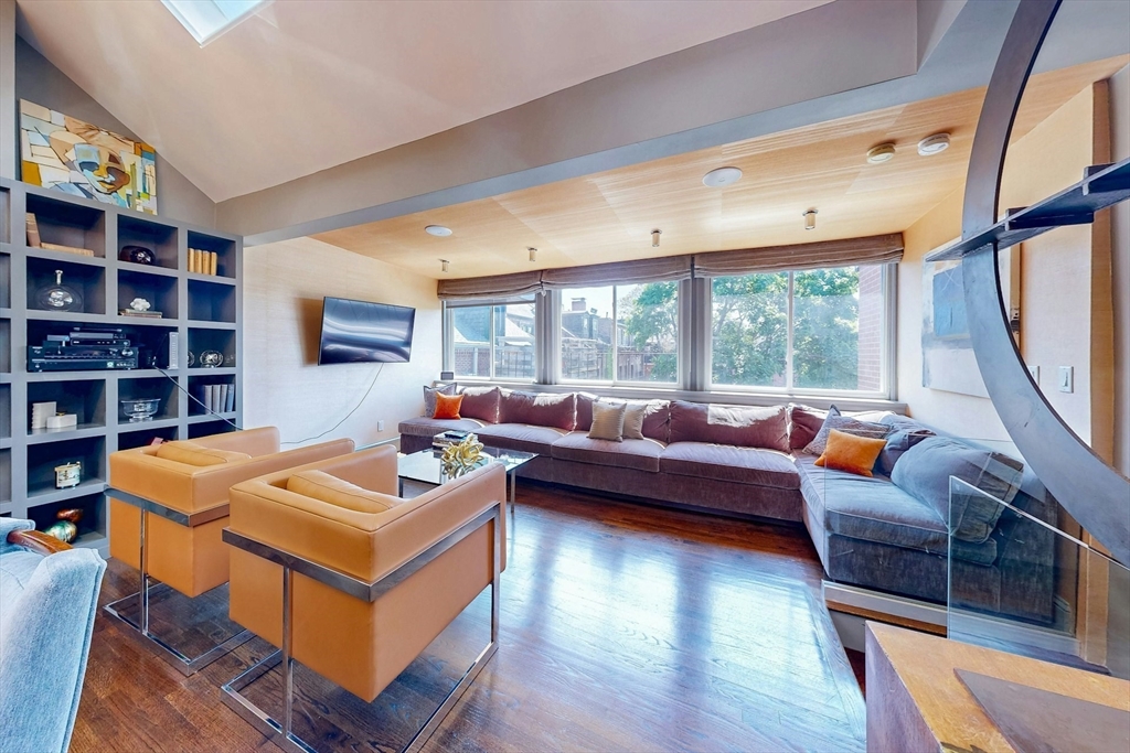 38 Worcester Street, Unit 3 Boston, MA 02118 - Photo 14 of 24 a living room with furniture a rug potted plant and a large window