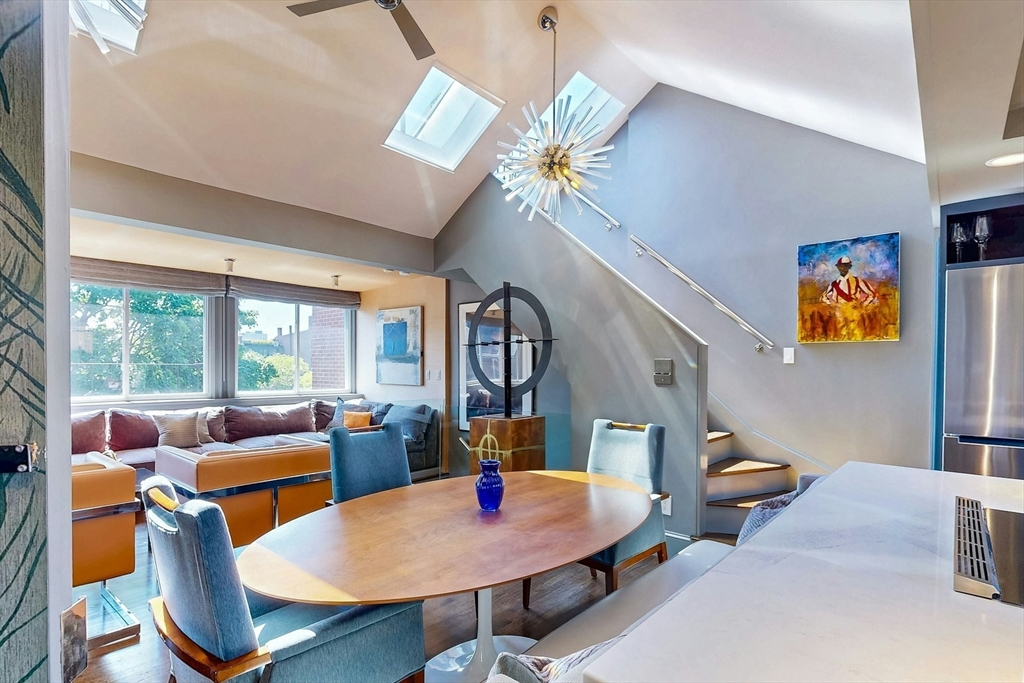 38 Worcester Street, Unit 3 Boston, MA 02118 - Photo 17 of 24 a living room with furniture a fireplace and a flat screen tv