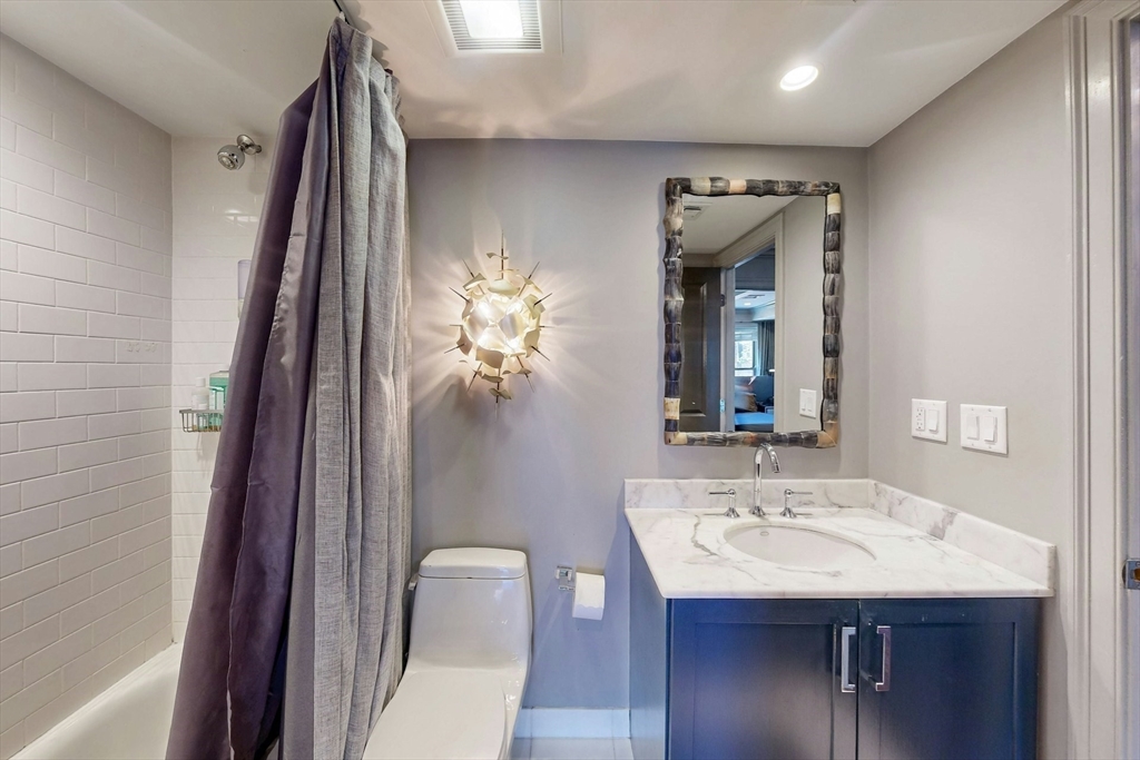 38 Worcester Street, Unit 3 Boston, MA 02118 - Photo 9 of 24 a bathroom with a sink vanity and a mirror