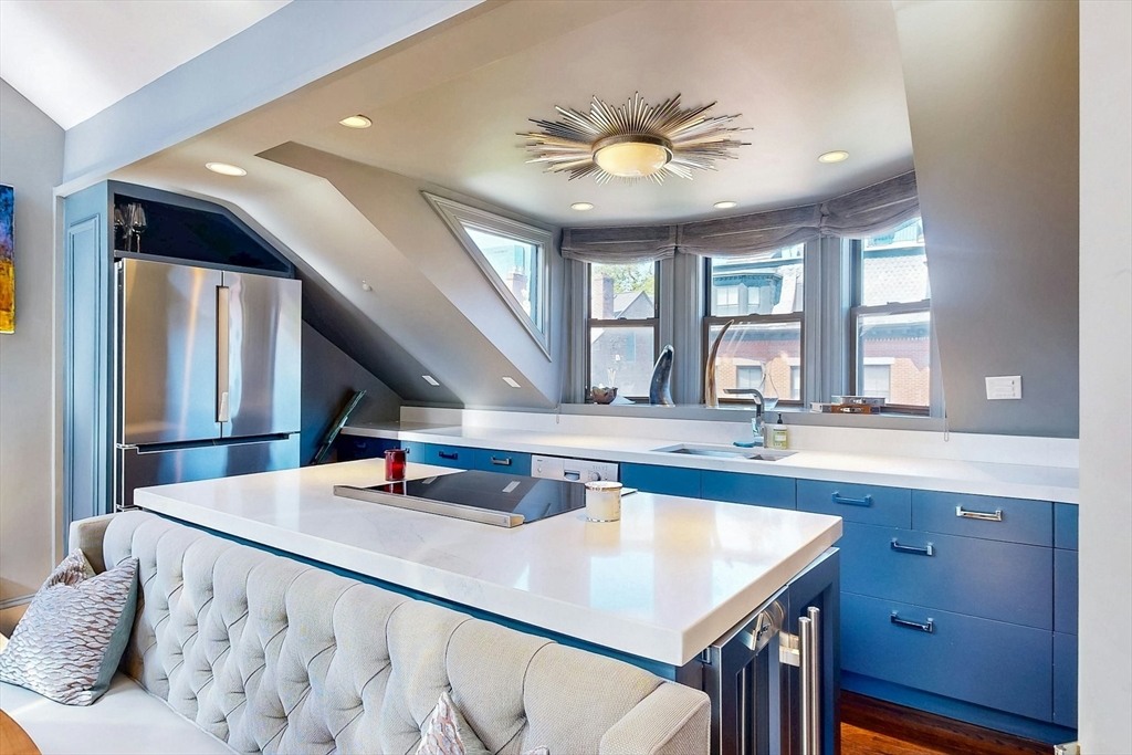 38 Worcester Street, Unit 3 Boston, MA 02118 - Photo 10 of 24 a kitchen with a sink appliances and a large window