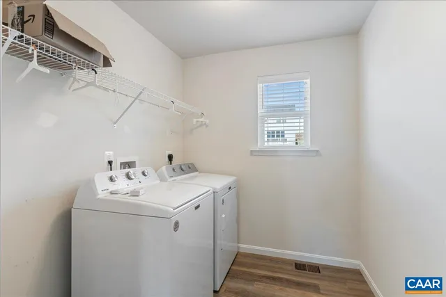 an empty room with windows and mirror