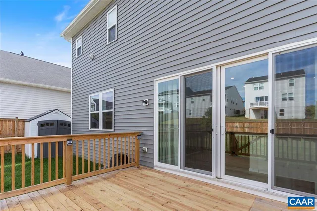 a view of a house with backyard and porch