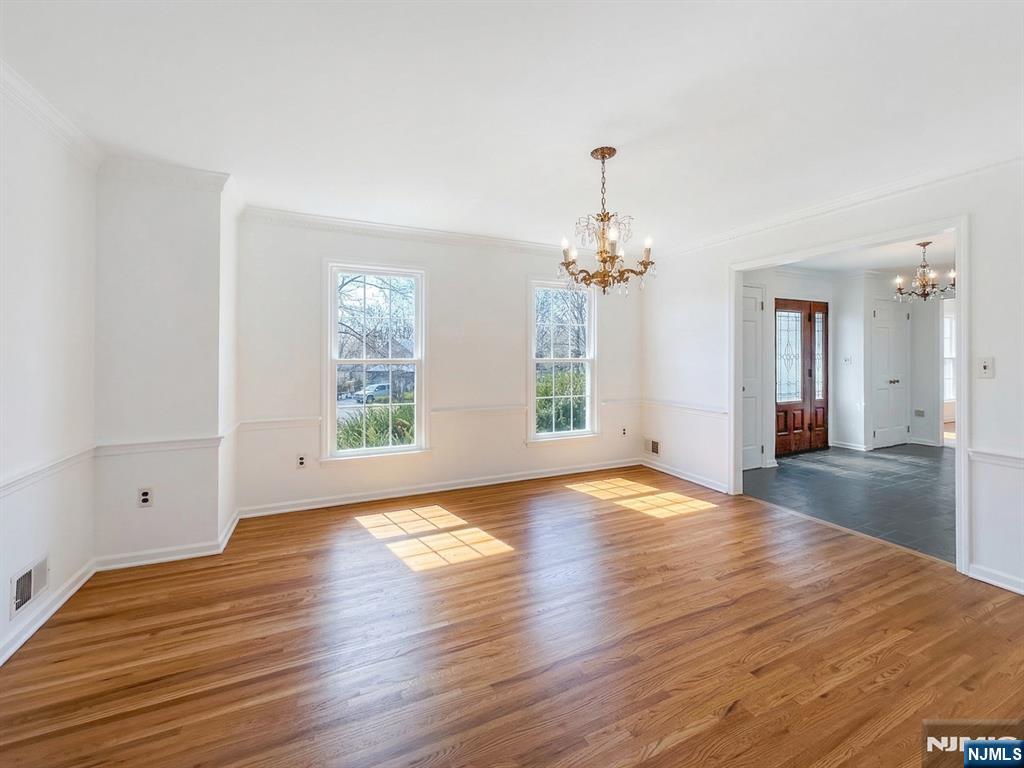 139 Berkeley Circle Bernards, NJ 07920 - Photo 12 of 36 a view of empty room with wooden floor and fan