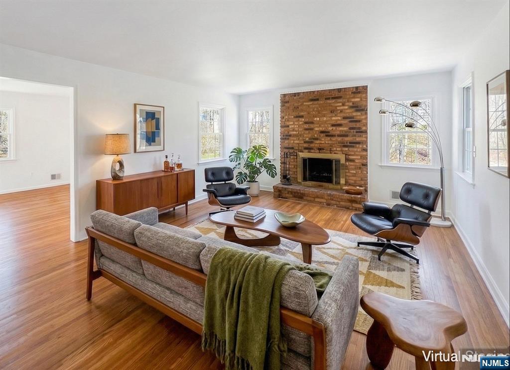 139 Berkeley Circle Bernards, NJ 07920 - Photo 14 of 36 a living room with furniture fireplace and a fireplace