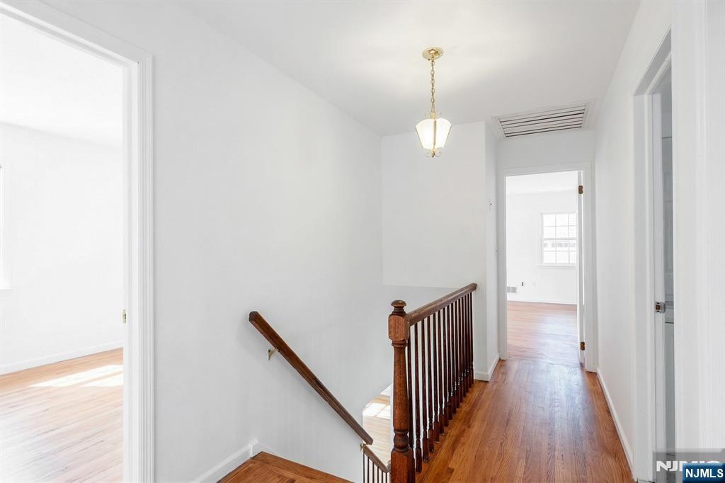139 Berkeley Circle Bernards, NJ 07920 - Photo 15 of 36 a view of a hallway with wooden floor