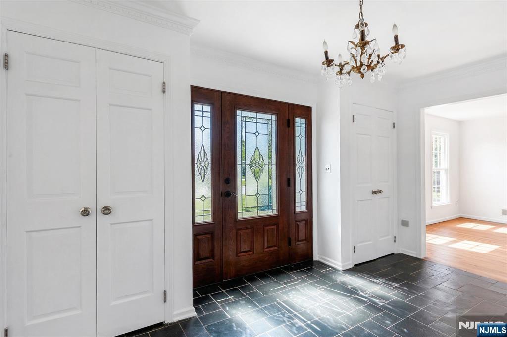 139 Berkeley Circle Bernards, NJ 07920 - Photo 2 of 36 a view of a hallway with wooden floor and closet