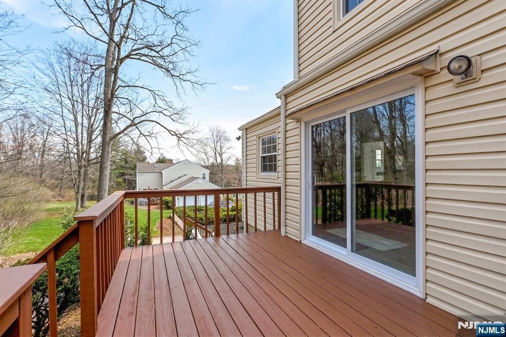139 Berkeley Circle Bernards, NJ 07920 - Photo 33 of 36 a view of balcony with wooden floor and fence