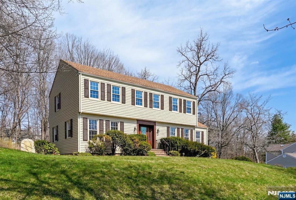 139 Berkeley Circle Bernards, NJ 07920 - Photo 35 of 36 a front view of a house with a yard
