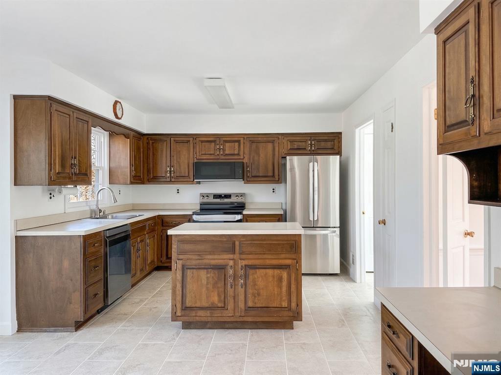 139 Berkeley Circle Bernards, NJ 07920 - Photo 8 of 36 a kitchen with a sink appliances and cabinets