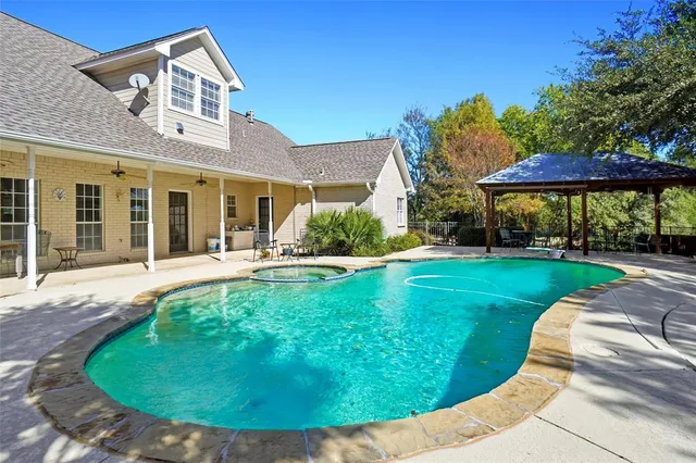 a view of a house with a swimming pool
