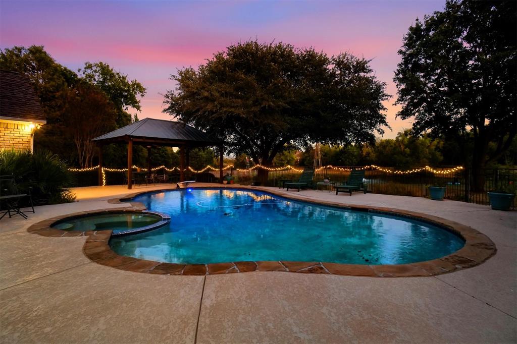 354 Jobson Road Sunnyvale, TX 75182 - Photo 13 of 39 a view of a swimming pool with a yard